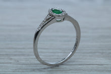 Load image into Gallery viewer, Emerald and Diamond Halo Ring