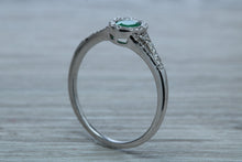 Load image into Gallery viewer, Emerald and Diamond Halo Ring