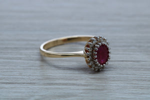 Oval cut Ruby and Diamond Cluster Ring