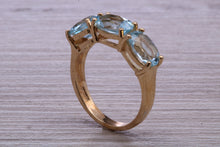 Load image into Gallery viewer, Sky Blue Topaz set Yellow Gold Twist Shank Ring
