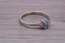 Load image into Gallery viewer, Petite Blue topaz and Diamond set White Gold Trilogy Ring