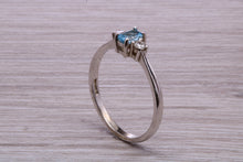 Load image into Gallery viewer, Petite Blue topaz and Diamond set White Gold Trilogy Ring