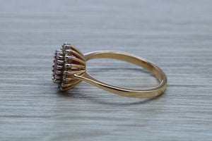 Oval cut Ruby and Diamond Cluster Ring