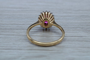 Oval cut Ruby and Diamond Cluster Ring