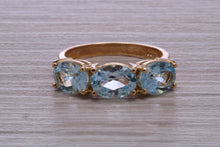 Load image into Gallery viewer, Sky Blue Topaz set Yellow Gold Twist Shank Ring