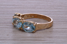 Load image into Gallery viewer, Sky Blue Topaz set Yellow Gold Twist Shank Ring