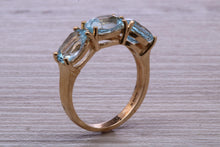 Load image into Gallery viewer, Sky Blue Topaz set Yellow Gold Twist Shank Ring