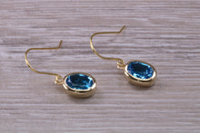 Load image into Gallery viewer, Oval cut Blue Topaz set Yellow Gold Dropper Earrings