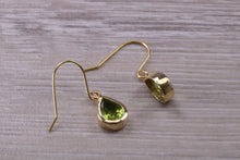 Load image into Gallery viewer, Tear Drop cut Peridot set Dropper Earrings set in Yellow gold