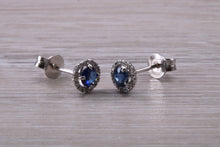 Load image into Gallery viewer, Blue Sapphire and Diamond Halo set Stud Earrings
