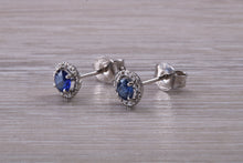Load image into Gallery viewer, Blue Sapphire and Diamond Halo set Stud Earrings