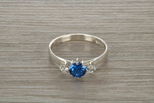 Load image into Gallery viewer, Sterling Silver Sapphire Blue C Z Trilogy Ring