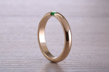 Load image into Gallery viewer, Tension set Emerald in Chunky Yellow Gold Band, British Hallmarked