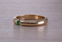 Load image into Gallery viewer, Tension set Emerald in Chunky Yellow Gold Band, British Hallmarked