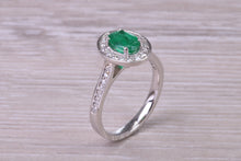 Load image into Gallery viewer, Emerald and Halo Diamond set Platinum Ring