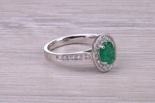 Load image into Gallery viewer, Emerald and Halo Diamond set Platinum Ring