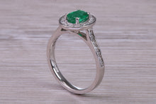 Load image into Gallery viewer, Emerald and Halo Diamond set Platinum Ring