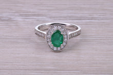 Load image into Gallery viewer, Emerald and Halo Diamond set Platinum Ring