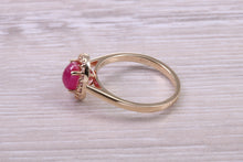 Load image into Gallery viewer, Stunning Cabochon cut 1.40 carat Ruby and Halo set Diamond Ring in Yellow Gold