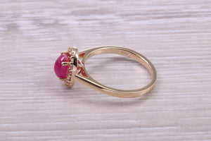 Stunning Cabochon cut 1.40 carat Ruby and Halo set Diamond Ring in Yellow Gold