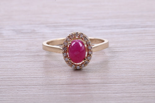 Stunning Cabochon cut 1.40 carat Ruby and Halo set Diamond Ring in Yellow Gold