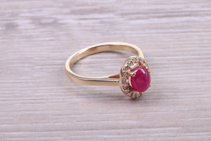 Stunning Cabochon cut 1.40 carat Ruby and Halo set Diamond Ring in Yellow Gold