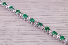 Load image into Gallery viewer, Four and Half carats Natural Emeralds and Diamonds set White Gold Tennis Bracelet, British Hallmarked