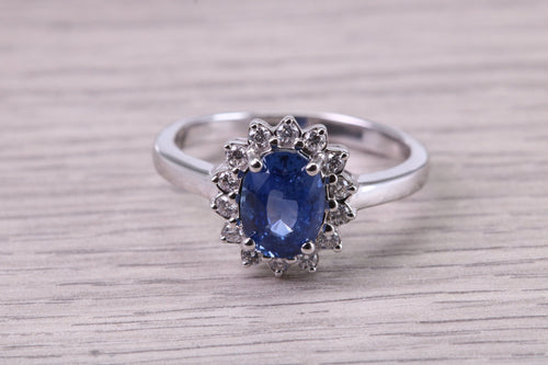 Natural 1.37ct Oval cut Vivid Royal Blue Sapphire and 0.25ct Top Graded Natural Round Diamonds set 18ct White Gold Ring,