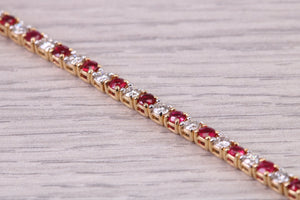 Four carats Natural Rubies and Diamonds set Solid Yellow Gold Tennis Bracelet, British Hallmarked