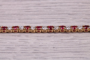 Four carats Natural Rubies and Diamonds set Solid Yellow Gold Tennis Bracelet, British Hallmarked