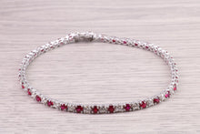 Load image into Gallery viewer, Four carats Natural Rubies and Diamonds set Solid White Gold Tennis Bracelet, British Hallmarked