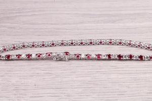 Four carats Natural Rubies and Diamonds set Solid White Gold Tennis Bracelet, British Hallmarked