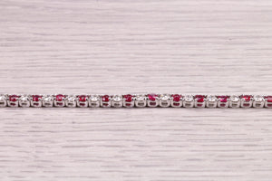 Four carats Natural Rubies and Diamonds set Solid White Gold Tennis Bracelet, British Hallmarked