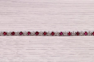 Four carats Natural Rubies and Diamonds set Solid White Gold Tennis Bracelet, British Hallmarked