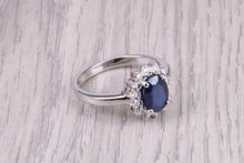 Load image into Gallery viewer, Natural 1.45ct Oval cut Royal Blue Sapphire and 0.25ct Top Graded Natural Round Diamonds set 18ct White Gold Ring, British Hallmarked