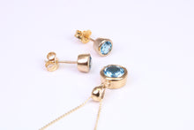 Load image into Gallery viewer, Round cut Blue Topaz Matching Earrings and Necklace set in Yellow Gold
