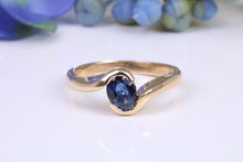 Load image into Gallery viewer, Beautiful 0.90 carat Oval cut Blue Sapphire Twist Shank Solitaire, British Hallmarked Yellow Gold