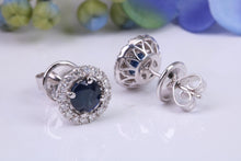 Load image into Gallery viewer, Beautiful One carat each Blue Sapphire and Diamond Halo set Earrings, 18ct White Gold, British Hallmarked