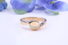Load image into Gallery viewer, Oval cut Natural Opal set in Chunky Crossover Yellow Gold Ring