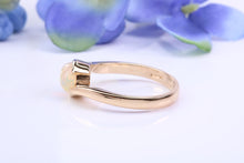 Load image into Gallery viewer, Oval cut Natural Opal set in Chunky Crossover Yellow Gold Ring