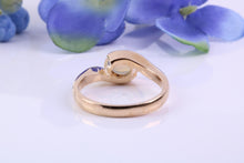 Load image into Gallery viewer, Oval cut Natural Opal set in Chunky Crossover Yellow Gold Ring