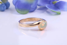 Load image into Gallery viewer, Oval cut Natural Opal set in Chunky Crossover Yellow Gold Ring
