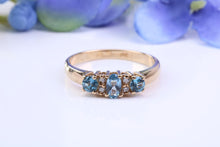 Load image into Gallery viewer, Sky Blue Topaz and Diamond set Yellow Gold Ring