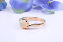 Load image into Gallery viewer, Oval cut Natural Opal set in Chunky Crossover Yellow Gold Ring