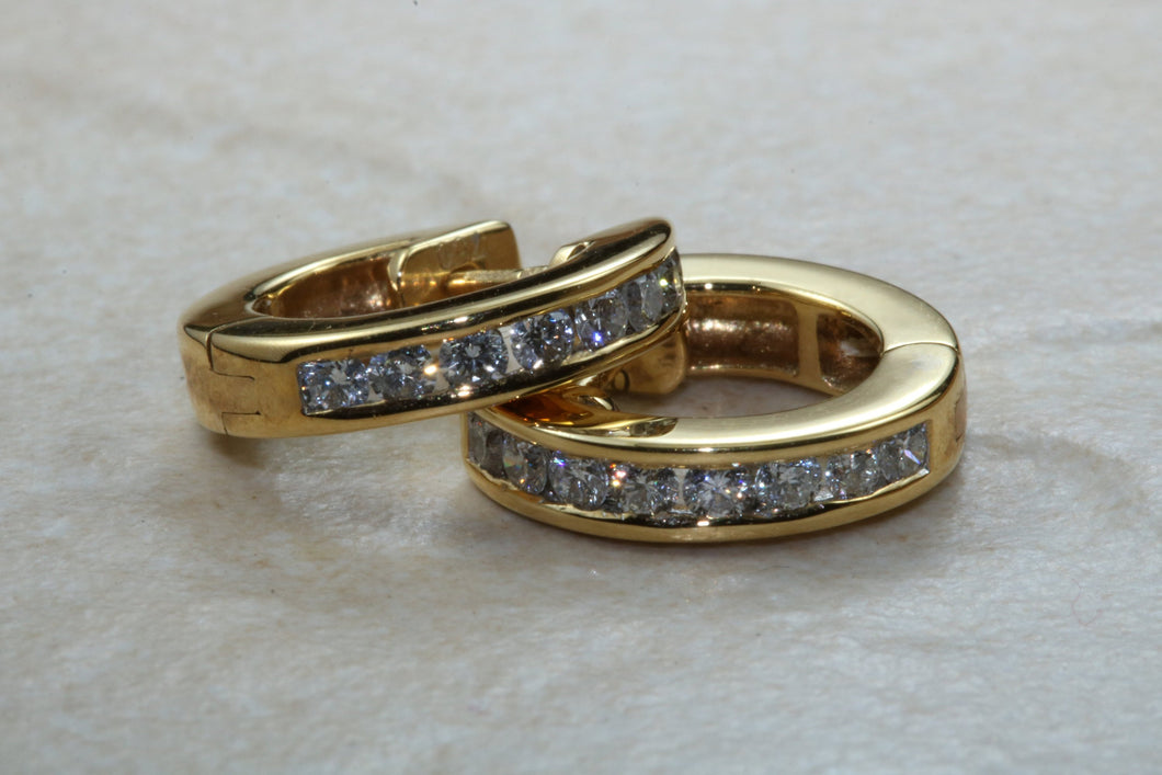 Diamond set half hoop earrings. 18ct Gold with Latchback fittings.Perfect gift solution for any occasion. F VS1 grade Diamonds