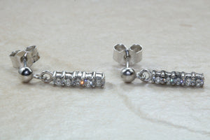 Diamond set dropper earrings. 18ct Gold with Latchback fittings.Perfect gift solution for any occasion. F VS1 grade Diamonds