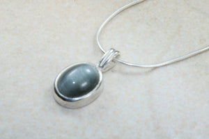 Natural Black Cats Eye pendant together with 16 inch long chain, 925 grade sterling silver, healing gemstones.