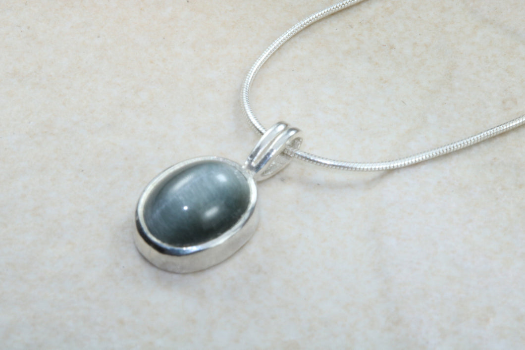 Natural Black Cats Eye pendant together with 16 inch long chain, 925 grade sterling silver, healing gemstones.