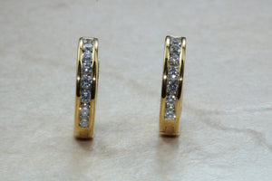 Diamond set half hoop earrings. 18ct Gold with Latchback fittings.Perfect gift solution for any occasion. F VS1 grade Diamonds