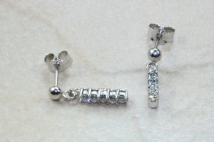Diamond set dropper earrings. 18ct Gold with Latchback fittings.Perfect gift solution for any occasion. F VS1 grade Diamonds